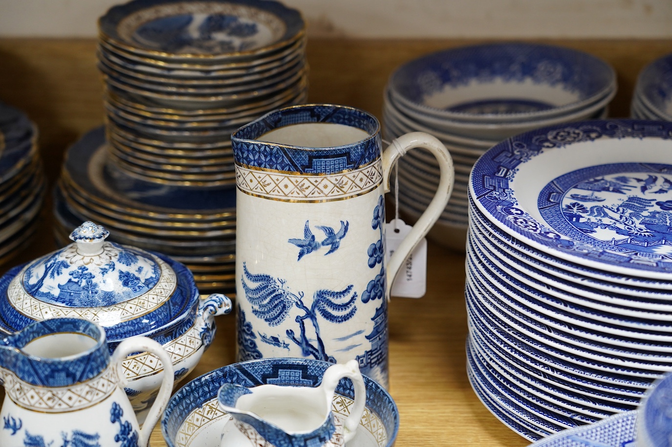 A large collection of Booths Real Old Willow, Woods Ware Willow and Old Chelsea blue and white dinner wares - condition - fair to good